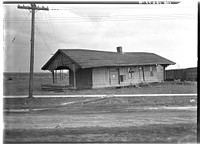 The old Louisville and Nashville Railroad station after the flood. Shawneetown, Illinois. Note flood marks on building by Russell Lee