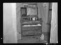 Bureau in the bedroom in the house, occupied by the Ingrahams and the Smallwoods near Nelma, Wisconsin by Russell Lee