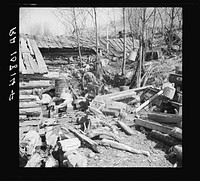 Backyard of Buckboard Charlie's shack near Iron River, Michigan by Russell Lee