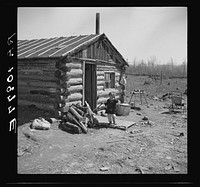 One of the Bodray children in front of the family home near Tipler, Wisconsin by Russell Lee