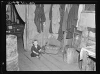One of Max Sparks' children in their home near Long Lake, Wisconsin. This child is a deaf mute by Russell Lee