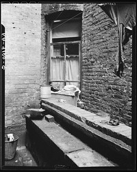 [Untitled photo, possibly related to: One of the rear windows, tenement dwelling of Mr. and Mrs. Jacob Solomon, 133 Aveue D, New York City. The Solomon family are on the accepted list for resettlement at Hightstown, New Jersey]. Sourced from the Library of Congress.
