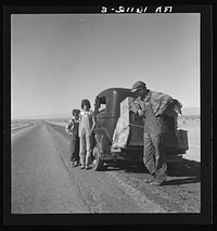 Oklahoma sharecropper and family entering California. Stalled on the desert near Indio, California. Sourced from the Library of Congress.