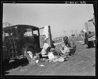 Oklahomans bound for Oregon along a highway in California. Sourced from the Library of Congress.