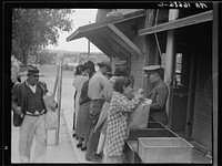 Plant quarantine inspectors examining packages brought over the bridge between Juarez, Mexico and El Paso, Texas. Families and housewives returning to their homes in El Paso after their Saturday marketing in Juarez, where they benefit by the present rate of exchange. Sourced from the Library of Congress.