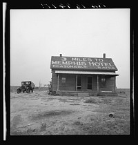 The tractor driver (#16949) gets a dollar a day, this house to live in, and a cow to milk for working ten to eleven and a half hours daily. Three miles from Memphis, Texas. Sourced from the Library of Congress.