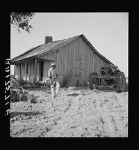 Colored tractor driver and empty cabin on mechanized cotton plantation.  Aldridge Plantation near Leland, Mississippi. Sourced from the Library of Congress.