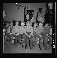 Children at Halloween party, waiting for signal to come for refreshments. Shafter migrant camp, California by Dorothea Lange