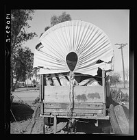 Near Holtville, Imperial Valley. Again the covered wagon. In migratory carrot puller's camp. Sourced from the Library of Congress.