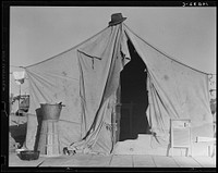 [Untitled photo, possibly related to: One of a row of tents, home of a pea picker. Near Calipatria, Imperial Valley, California]. Sourced from the Library of Congress.