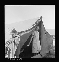Migrant woman from Arkansas living in contractor's camp near Westley, California. Sourced from the Library of Congress.