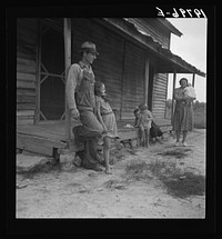 [Untitled photo, possibly related to: Tobacco sharecropper with his oldest daughter. Person County, North Carolina]. Sourced from the Library of Congress.