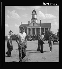 [Untitled photo, possibly related to: Courthouse, Pittsboro, North Carolina. Note ever present Confederate States of America monument]. Sourced from the Library of Congress.