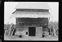 Tobacco barn with front shelter. Olive Hill, North Carolina. Sourced from the Library of Congress.