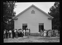 [Untitled photo, possibly related to: Congregation gathers in groups to talk after services are over. Wheeley's Church, Person County, North Carolina]. Sourced from the Library of Congress.