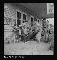[Untitled photo, possibly related to: Rural filling station becomes community center and general grounds for loafing. The men in baseball suits are on a local team which will play a game nearby. The team is called the Cedargrove Team. Fourth of July,  Near Chapel Hill, North Carolina]. Sourced from the Library of Congress.
