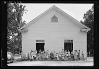 [Untitled photo, possibly related to: Women of the congregation of Wheeley's Church on steps with brooms and buckets on annual clean up day. Gordonton, North Carolina]. Sourced from the Library of Congress.