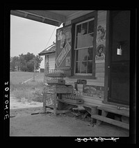 Country filling station owned and operated by tobacco farmer. Such small independent stations have become meeting places (community center) and loading spots for neighborhood farmers in their off times. Granville County, North Carolina. Sourced from the Library of Congress.