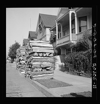 Woodpiles along the street are a characteristic of Portland, Oregon. Costs five dollars and fifty cents per cord, and must now be hauled thirty-five miles. Portland, Oregon. Sourced from the Library of Congress.