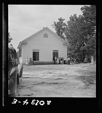 [Untitled photo, possibly related to: Congregation entering church. Wheeley's Church. Person County, North Carolina]. Sourced from the Library of Congress.