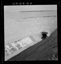 [Untitled photo, possibly related to: Washington, Yakima County, Roza Irrigation Canal. Sides concrete, lined by machine. The project, when complete in 1945, will open 72,000 acres to cultivation in East Yakima and West Benton Counties]. Sourced from the Library of Congress.