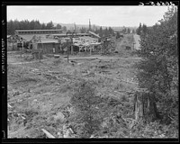 [Untitled photo, possibly related to: Mumby Lumber Mill, closed in 1938 after thirty-five years operation. Now being dismantled. Western Washington, Grays Harbor County, Malone, Washington]. Sourced from the Library of Congress.