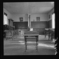 Interior of eastern Oregon one-room county school. Seven pupils enrolled. 8:45 a.m. Between Pleasant Valley and Durkee, Baker County, Oregon by Dorothea Lange