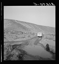 [Untitled photo, possibly related to: School bus starts up the flat 7:30 a.m. to collect children of new settlers. Malheur County, Oregon. General caption 67-1V]. Sourced from the Library of Congress.