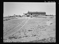 The Browning home, a partial dugout. Seven children live here. Dead Ox Flat, Malheur County, Oregon. General caption number 67. Sourced from the Library of Congress.