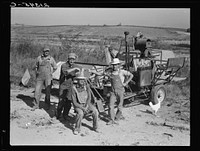 Stephen brothers. Joe, Jim, Eugene, Fred. All from Nebraska. All good farmers. Their combine purchased by FSA (Farm Security Administration) cooperators loan. Nyssa Heights district, Malheur County, Oregon. Sourced from the Library of Congress.