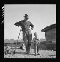 Mr. Dougherty and one of the children. Warm Springs district, Malheur County, Oregon. Sourced from the Library of Congress.