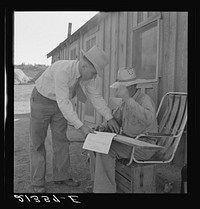 [Untitled photo, possibly related to: Oklahoma farmer, now living in Cow Hollow, is a FSA (Farm Security Administration) borrower. Seen here signing his chattel mortgage. Malheur County, Oregon]. Sourced from the Library of Congress.