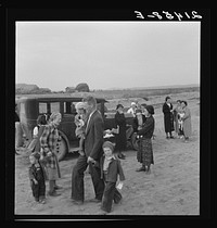 [Untitled photo, possibly related to: Congregation leaving after services. Preacher in doorway. Dead Ox Flat, Malheur County, Oregon]. Sourced from the Library of Congress.