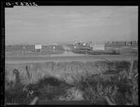 [Untitled photo, possibly related to: Entrance to Nyssa Farm family labor camp, FSA (Farm Security Administration) mobile unit number 1, just established before opening of beet season. Near Nyssa, Oregon]. Sourced from the Library of Congress.