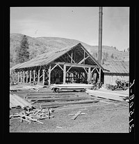 [Untitled photo, possibly related to: The sawmill in operation. It was built by the farmer members of the Ola self-help sawmill co-op. Gem County, Idaho. General caption 48]. Sourced from the Library of Congress.