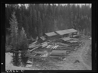 [Untitled photo, possibly related to: Small privately owned mill in the woods, recently discontinued. All the large mills in this area have cut out. Mission Creek, Boundary County, Idaho. General caption 49]. Sourced from the Library of Congress.