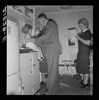 [Untitled photo, possibly related to: Doctor examining children in trailer clinic. FSA (Farm Security Administration) mobile camp, Klamath County, Oregon. See general caption 62]. Sourced from the Library of Congress.