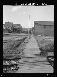 Boardwalk in Winton, Minnesota. A lumber "bust" town by Russell Lee