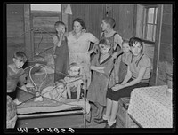 Family of Frank Peaches in their living room farm near Williston, North Dakota by Russell Lee