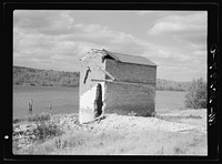 [Untitled photo, possibly related to: Remains of engine house of sawmill enterprise. "Bust" town of Winton, Minnesota] by Russell Lee