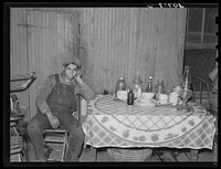 Mexican beet worker in his home near East Grand Forks, Minnesota by Russell Lee