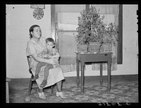 Mother and child in home near Williston, North Dakota by Russell Lee