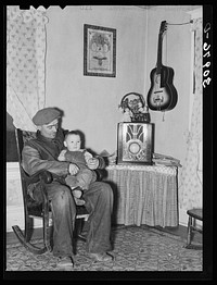 Blaze Gallagher and youngest son in home at Crosby, North Dakota. He was formerly a farmer by Russell Lee