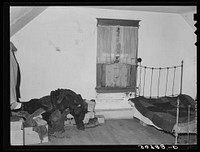 Upstairs bedroom in farmhouse of John Baker, farmer of Divide County, North Dakota by Russell Lee