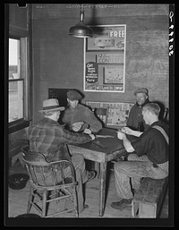 Card game in beer parlor. Alkabo, North Dakota by Russell Lee