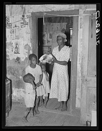 Southeast Missouri Farms. Sharecropper's wife and children. La Forge project, Missouri by Russell Lee