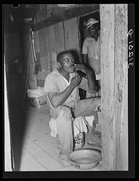 Southeast Missouri Farms. FSA (Farm Security Administration) client, former sharecropper, shaving by Russell Lee