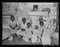 Sharecropper family in old home before moving to La Forge project, Missouri by Russell Lee