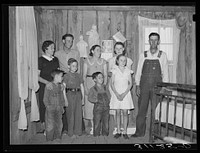 Sharecropper family in living room of shack home. La Forge project, Missouri by Russell Lee