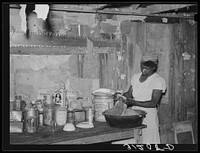 [Untitled photo, possibly related to: Southeast Missouri Farms. Sharecropper wife preparing midday meal] by Russell Lee